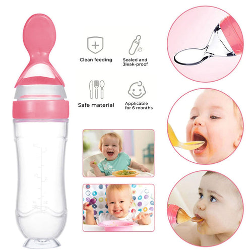 Pink baby feeding bottle with spoon attachment on a white background