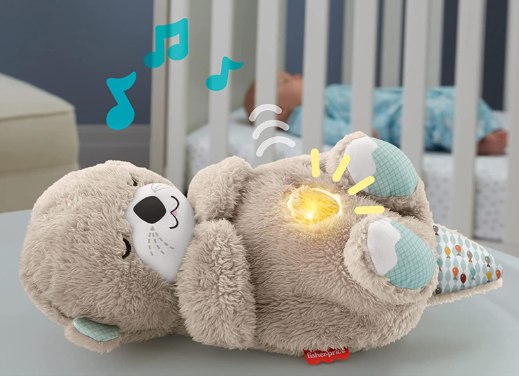 Plush toy with glowing eyes and musical notes in a nursery setting