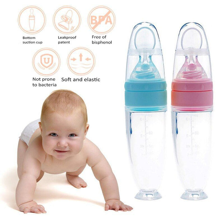 Two baby bottles with a baby crawling on the floor, featuring safety features and colors.